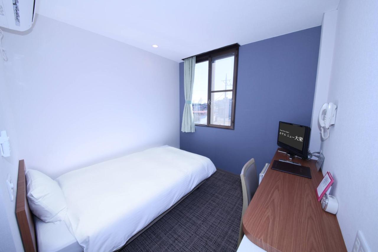 Business Hotel New Daiei Asikaga Kültér fotó